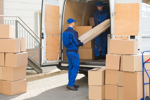 Moving team planning a home relocation in West Kensington