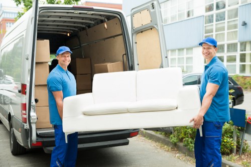 Careful loading of student furniture and personal belongings into a removals van