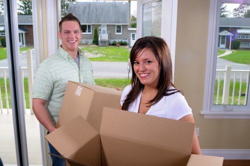 Packed moving boxes and furniture ready for removal van transport