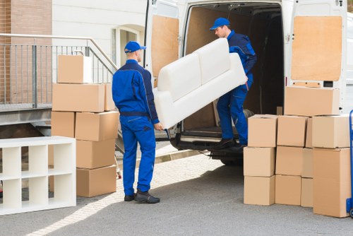 Packed boxes and furniture ready for removal from a local flat