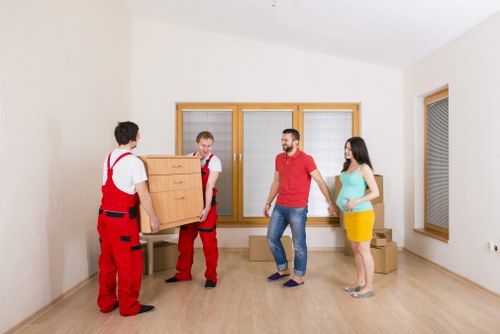 Transport team handling furniture during a house move
