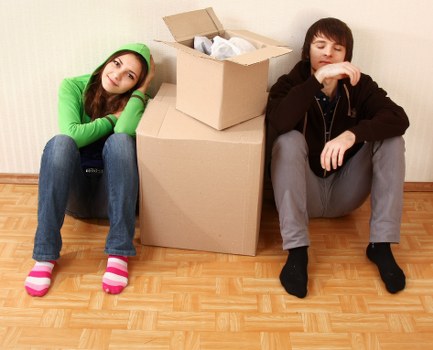 Packed office boxes and furniture ready for relocation in West Kensington