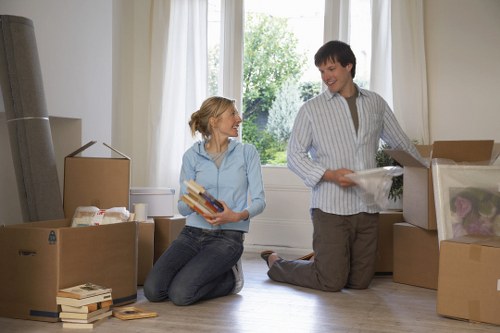 House removalists navigating stairs in a West Kensington property