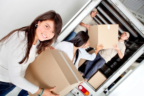 Careful loading of household items during a West Kensington move