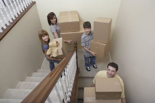 Packed office furniture and equipment ready for relocation in West Kensington